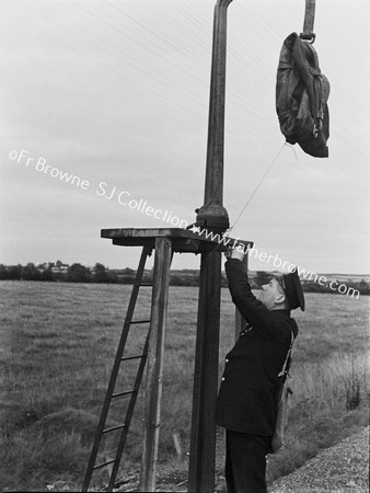 WORKER HANGS UP THE MAILBAG